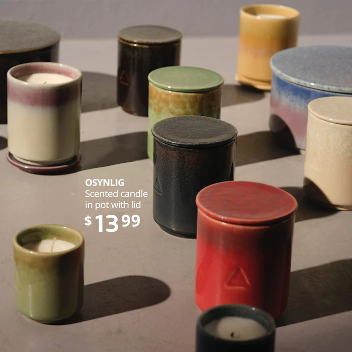 Several candles in colorful jars- New OSYNLIG Scented candle in pot with lid, $9.99.